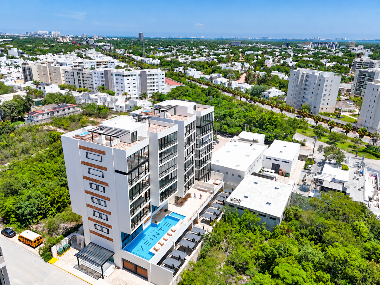 Aerial view of PUNTA VEINTE with a digitally composited pool-floor logo